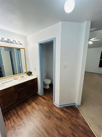 a spacious bathroom with a double vanity sink and a mirror