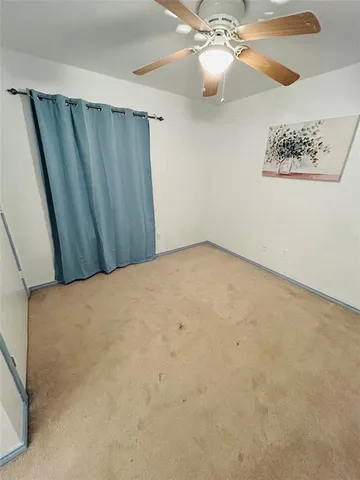 a view of a room with a fan