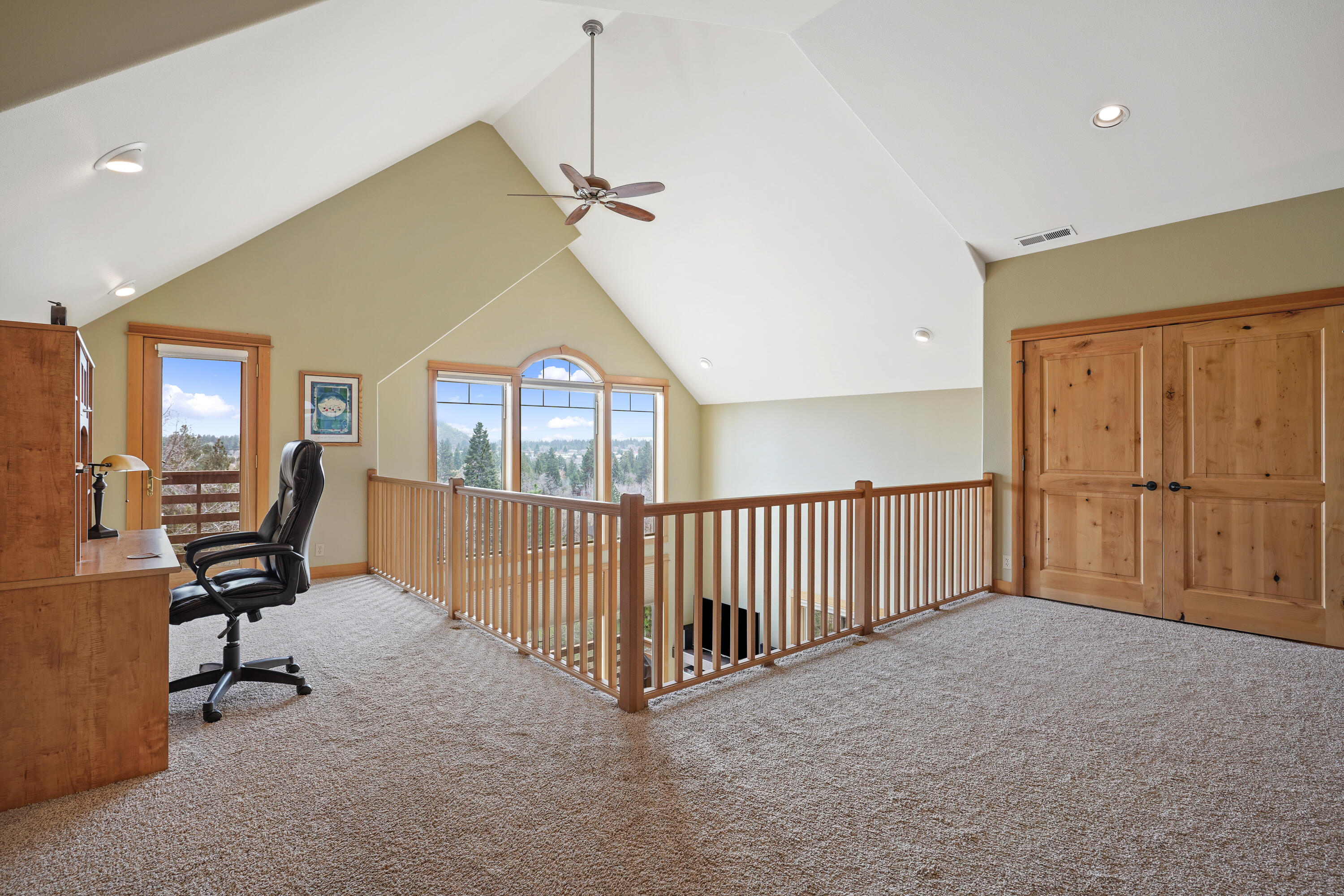 2155 Northwest Awbrey Road Bend, OR 97703 - Photo 19 of 44 a view of a livingroom with workspace and a window