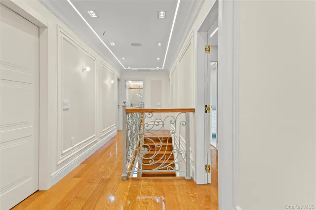 a view of an entryway with wooden floor