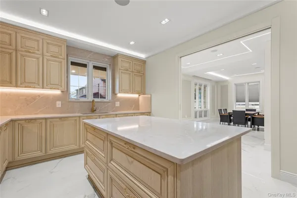 a kitchen with a sink dishwasher a stove and a refrigerator with wooden floor