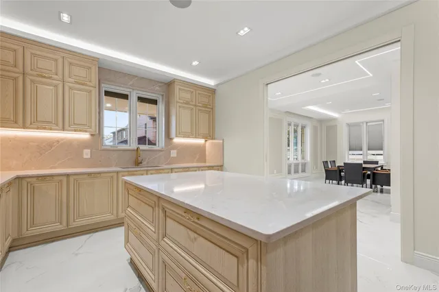 a kitchen with a sink dishwasher a stove and a refrigerator with wooden floor
