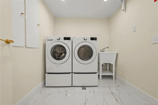 a utility room with dryer and washer