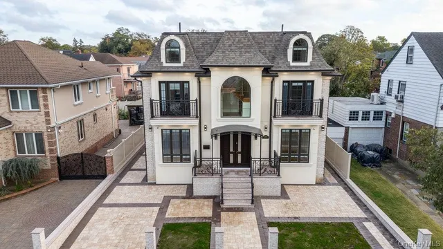 a picture of a room with a white wall and a refrigerator
