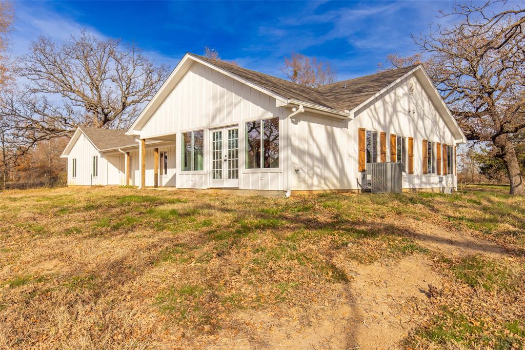 315 Private Road 7327 Emory, TX 75440 - Photo 11 of 39 a view of a house with a yard