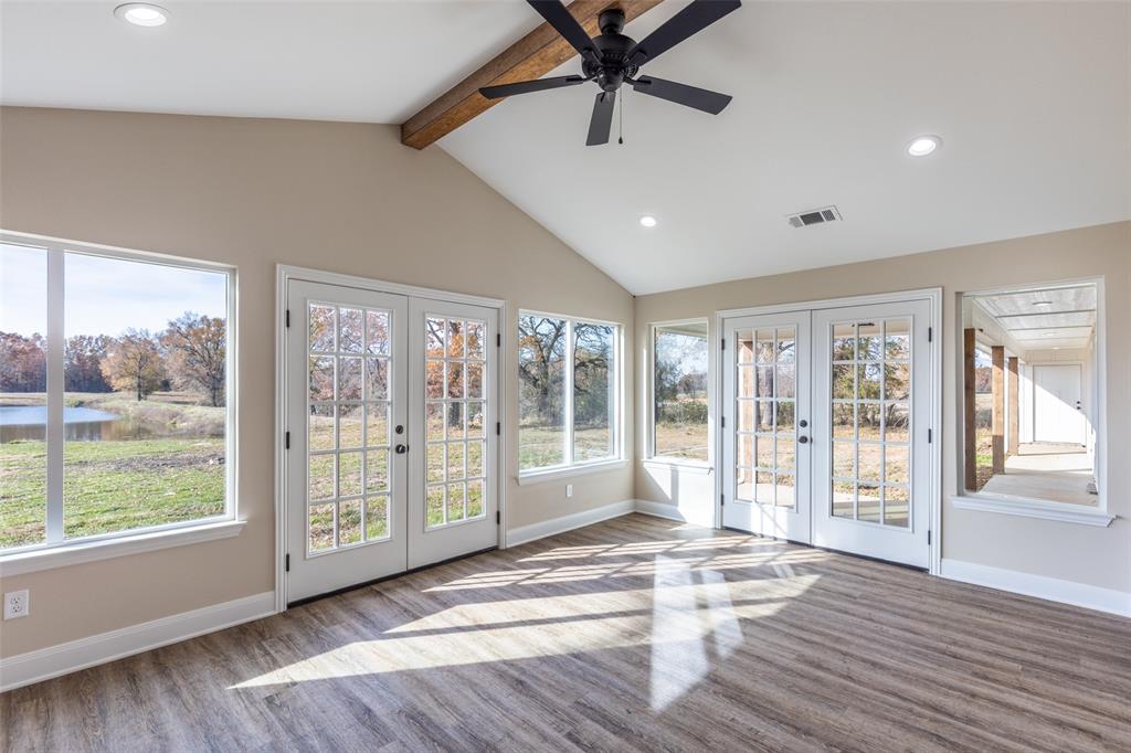 315 Private Road 7327 Emory, TX 75440 - Photo 28 of 39 a view of an entryway with wooden floor and windows