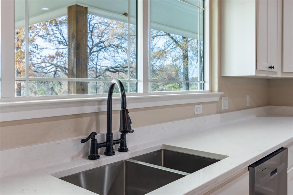 315 Private Road 7327 Emory, TX 75440 - Photo 29 of 39 a kitchen with a sink and large window