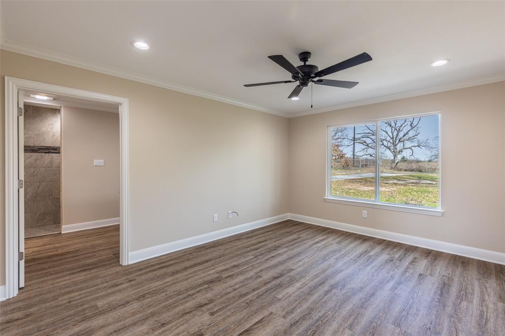 315 Private Road 7327 Emory, TX 75440 - Photo 30 of 39 a view of an empty room with wooden floor and a window