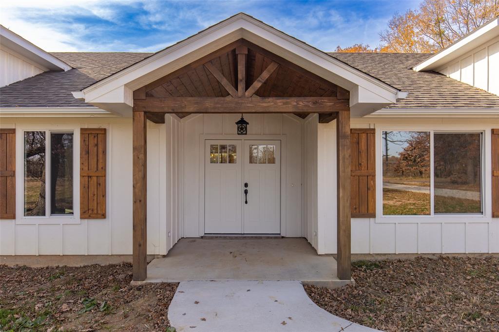 315 Private Road 7327 Emory, TX 75440 - Photo 10 of 39 a front view of a house with a yard
