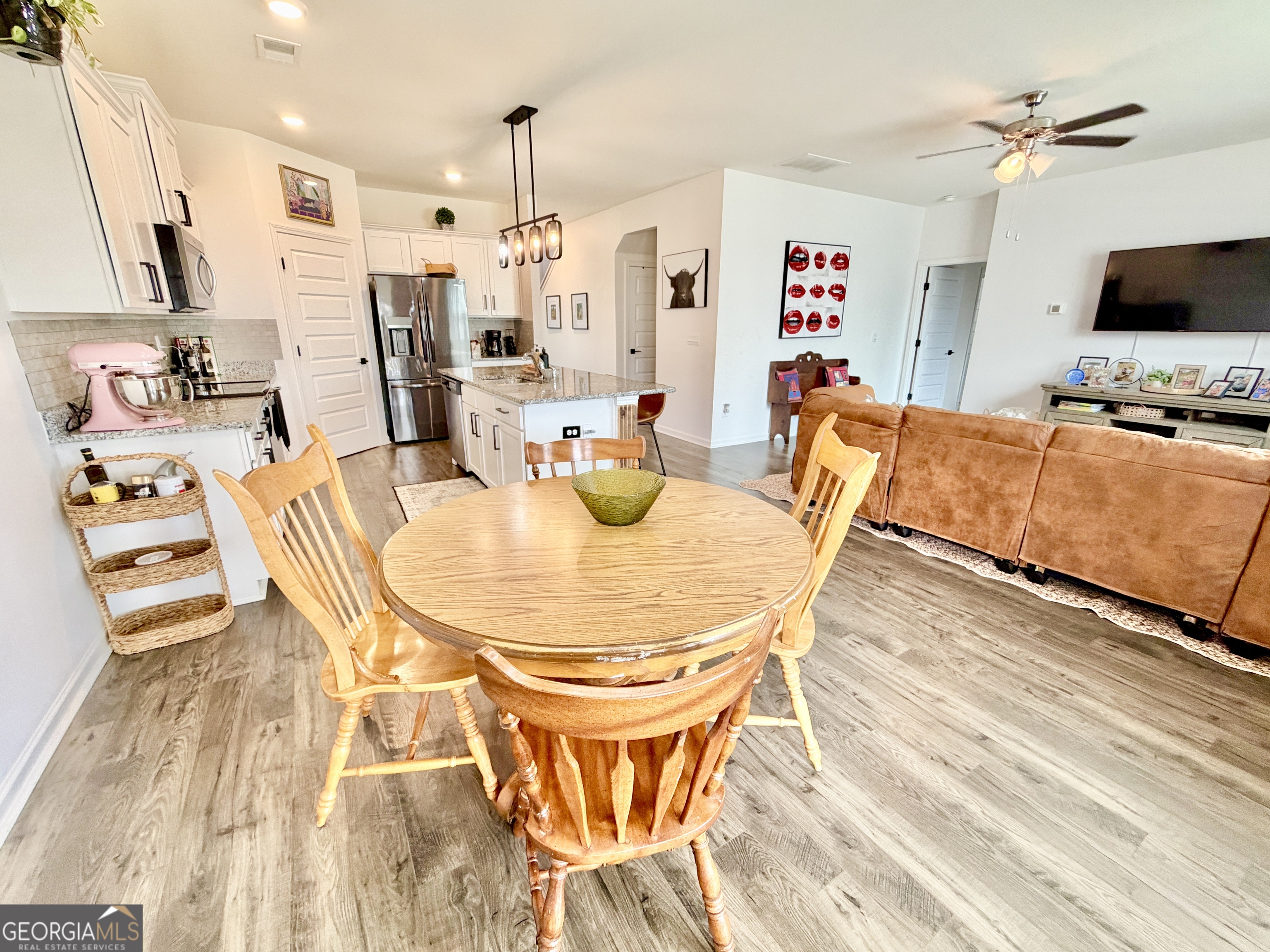 219 Barnyard Way Perry, GA 31069 - Photo 13 of 44 a dining room with furniture and wooden floor