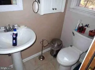 a bathroom with a sink and toilet