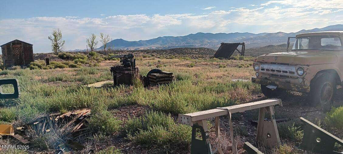 1 Iron Mine Road Crescent Valley, NV 89821 - Photo 21 of 46 a view of a house with a mountain and a yard