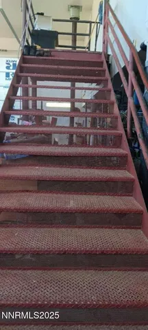 a white toilet sitting next to a window