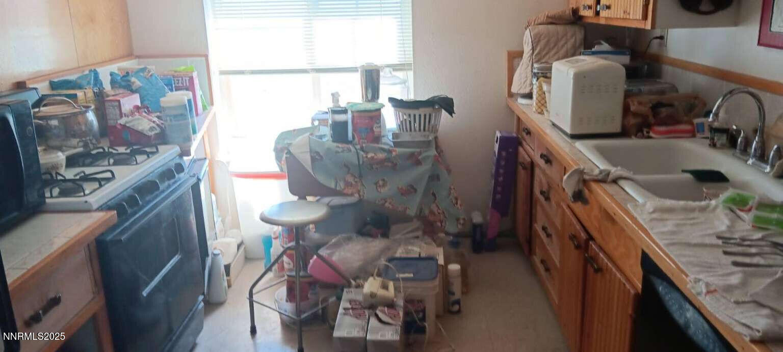 1 Iron Mine Road Crescent Valley, NV 89821 - Photo 40 of 46 a bathroom with a toilet sink and mirror