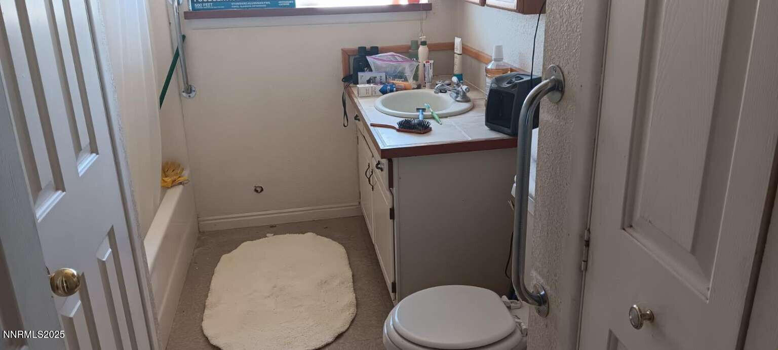 1 Iron Mine Road Crescent Valley, NV 89821 - Photo 41 of 46 a bathroom with a toilet and a sink