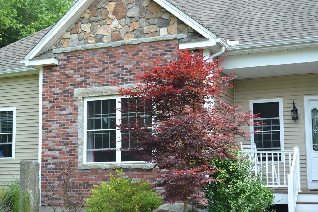 58 Gillespie Road Charlton, MA 01507 - Photo 3 of 39 a front view of a house with a garden