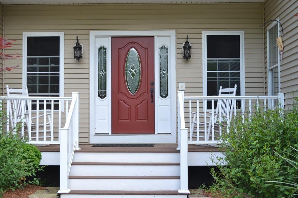 58 Gillespie Road Charlton, MA 01507 - Photo 8 of 39 a front view of a house with a iron gate