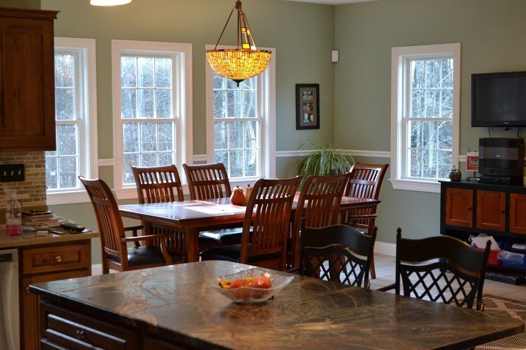 58 Gillespie Road Charlton, MA 01507 - Photo 9 of 39 a dining room with furniture a chandelier and wooden floor