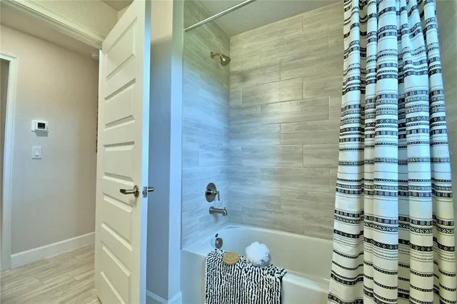 a workspace room with furniture and a window