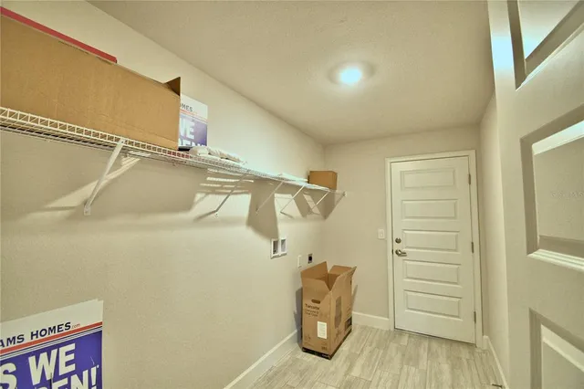 a bedroom with a bed and a mirror