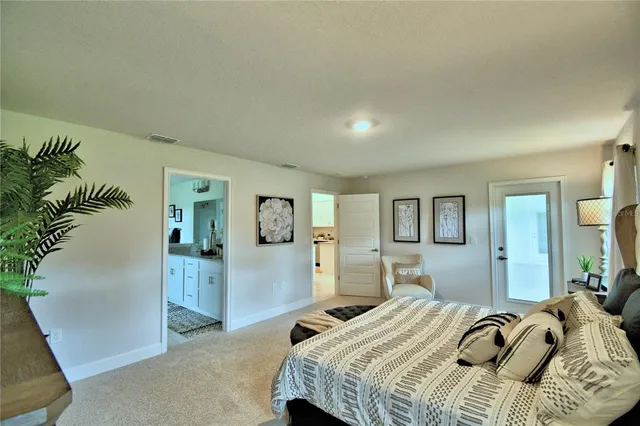 a bathroom with a granite countertop sink a mirror and shower