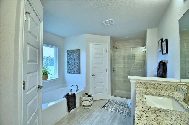 a kitchen with sink and refrigerator