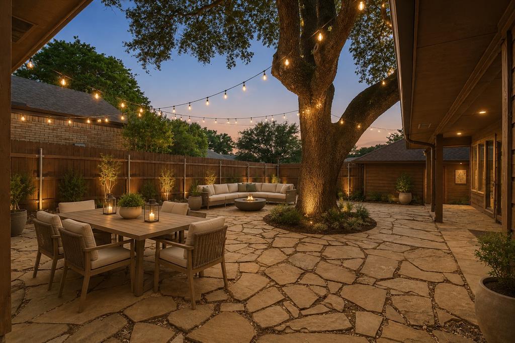 17003 Davenport Road Dallas, TX 75248 - Photo 38 of 40 a view of a patio with table and chairs with wooden fence and plants