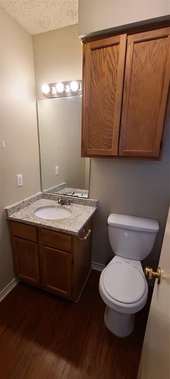 1907 Robbins Place, Unit 204 Austin, TX 78705 - Photo 7 of 7 Bathroom featuring vanity and dark wood-style floors