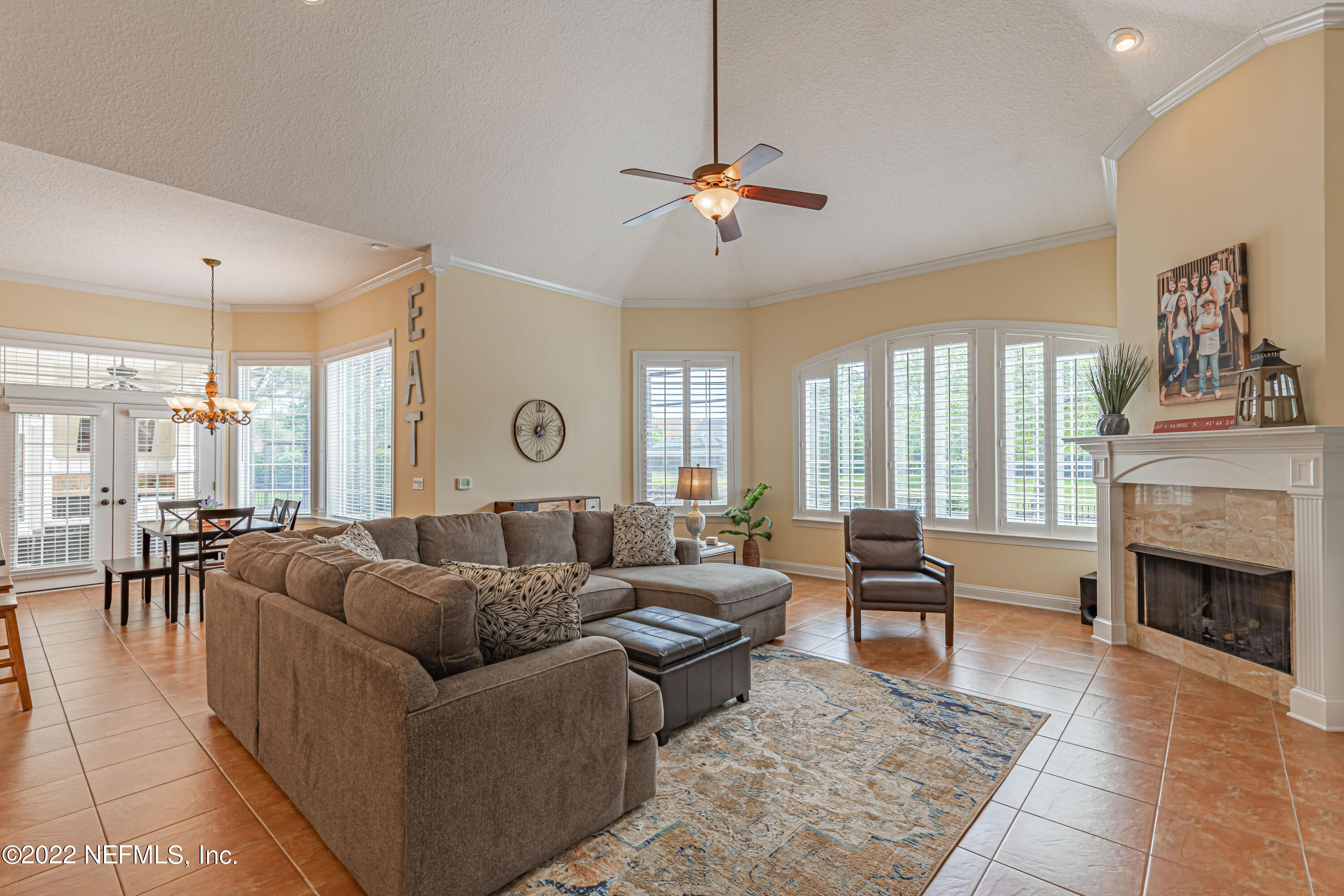 2723 Shade Tree Drive Fleming Island, FL 32003 - Photo 16 of 93 a living room with fireplace furniture and a large window