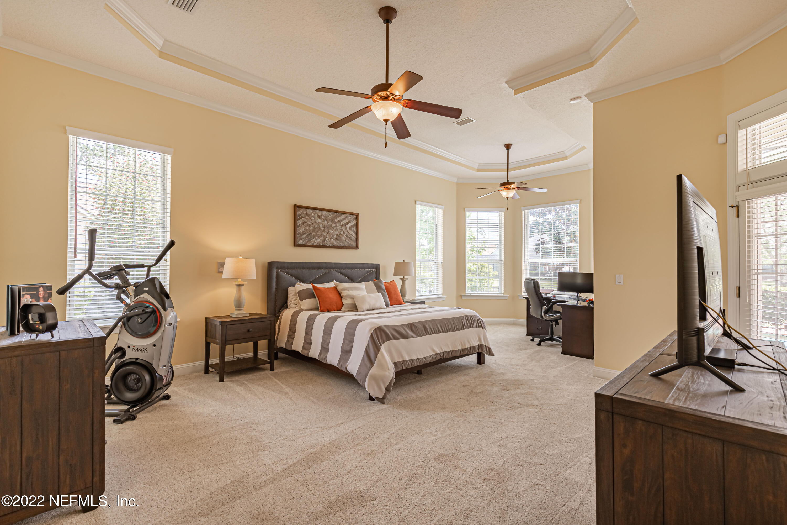 2723 Shade Tree Drive Fleming Island, FL 32003 - Photo 20 of 93 a spacious bedroom with a bed and a flat tv screen on dresser