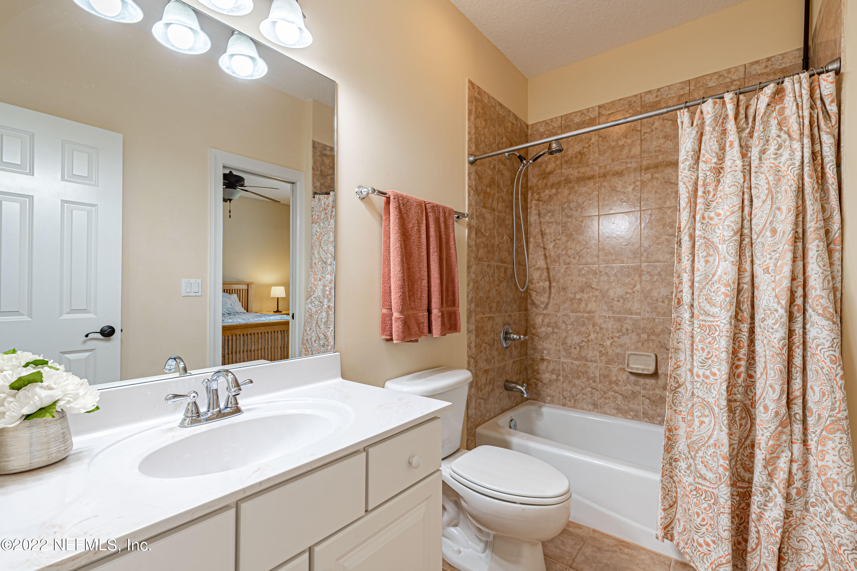 2723 Shade Tree Drive Fleming Island, FL 32003 - Photo 33 of 93 a bathroom with a granite countertop sink toilet and shower