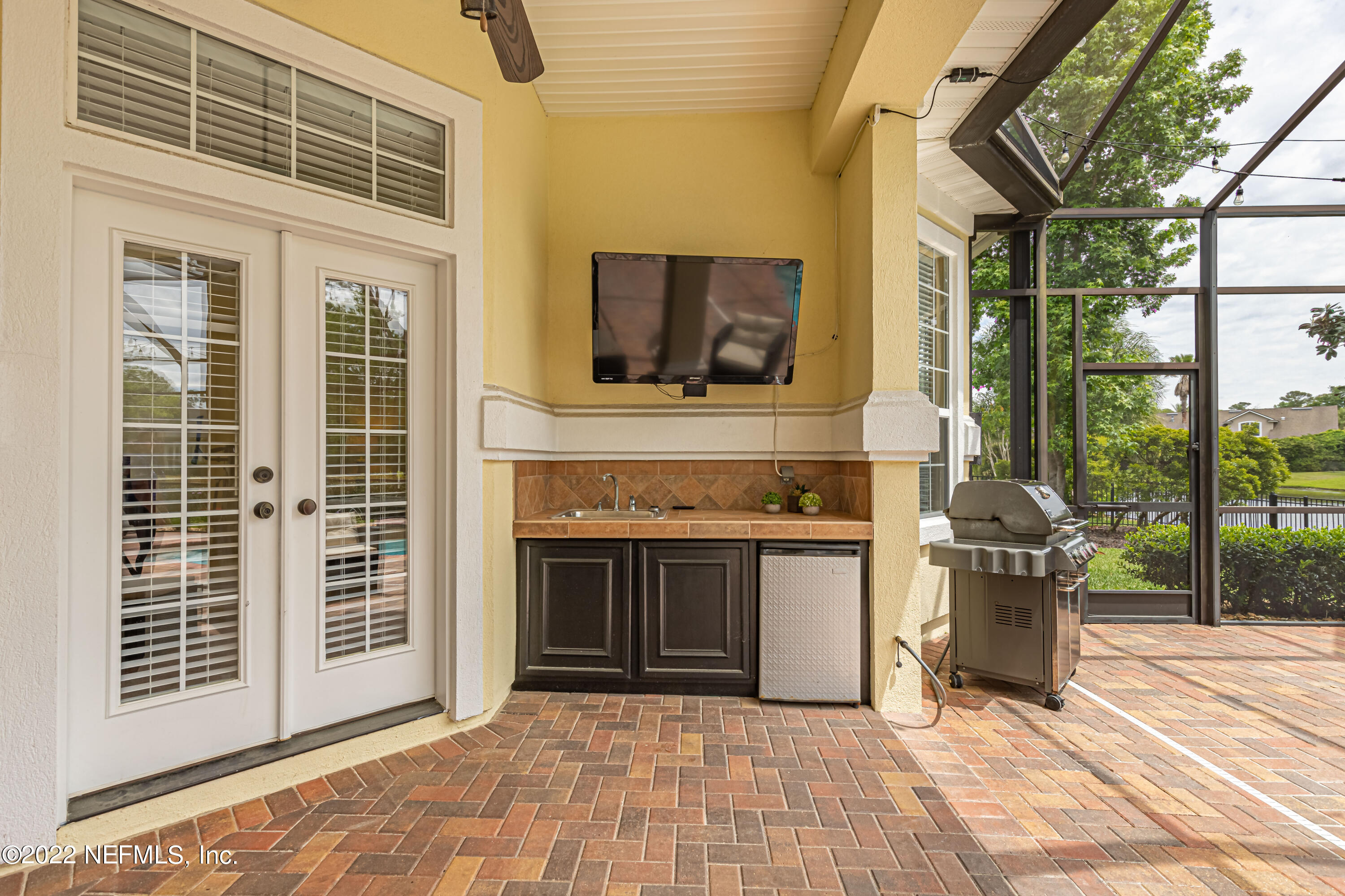 2723 Shade Tree Drive Fleming Island, FL 32003 - Photo 37 of 93 a view of a living room and a barbeque grill with a big yard