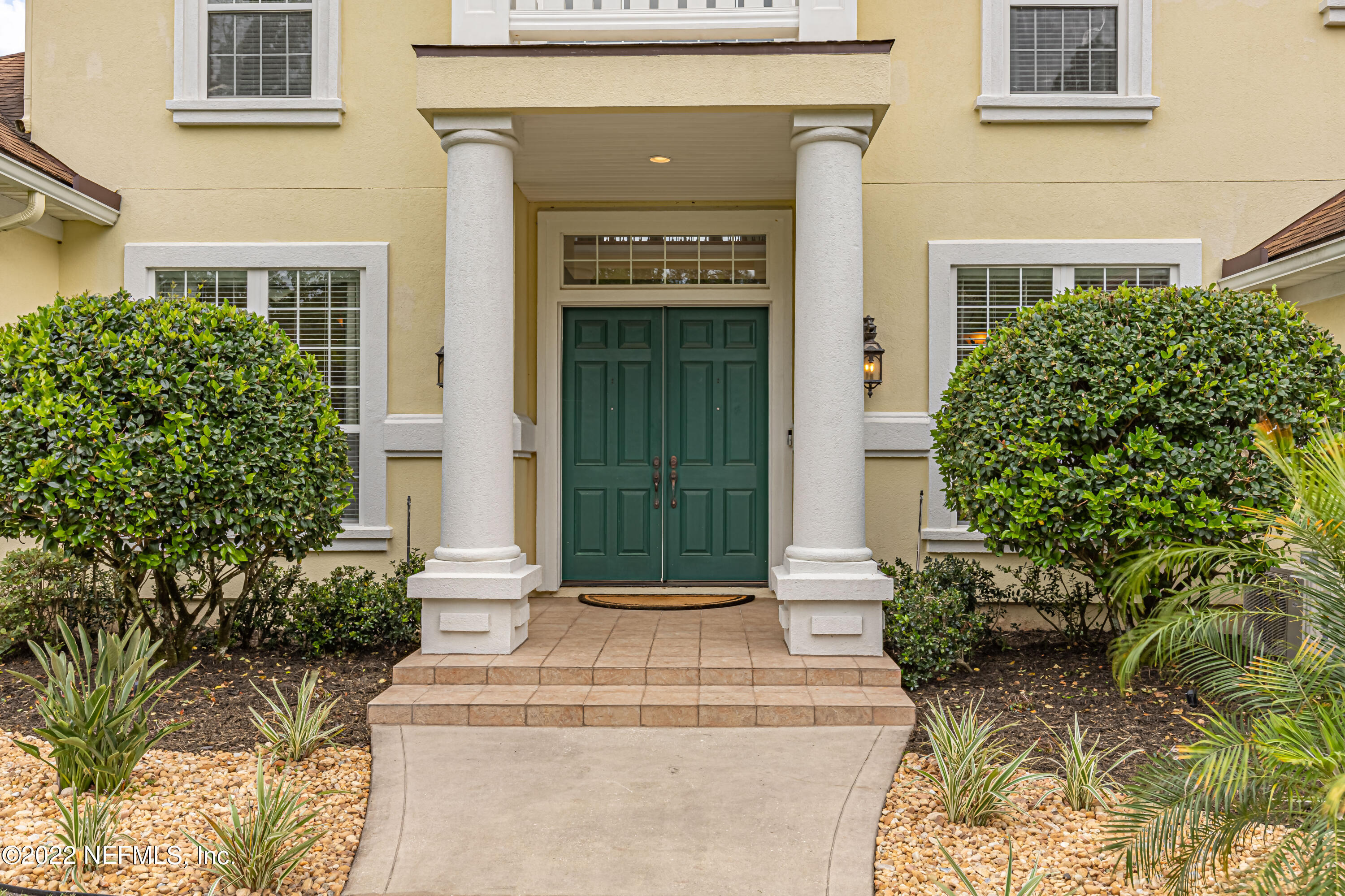 2723 Shade Tree Drive Fleming Island, FL 32003 - Photo 4 of 93 front view of a house with potted plants