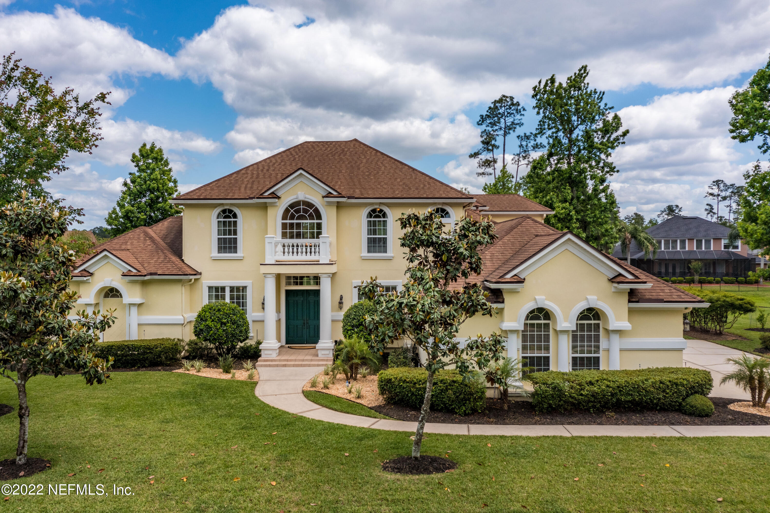2723 Shade Tree Drive Fleming Island, FL 32003 - Photo 45 of 93 a front view of a house with a garden