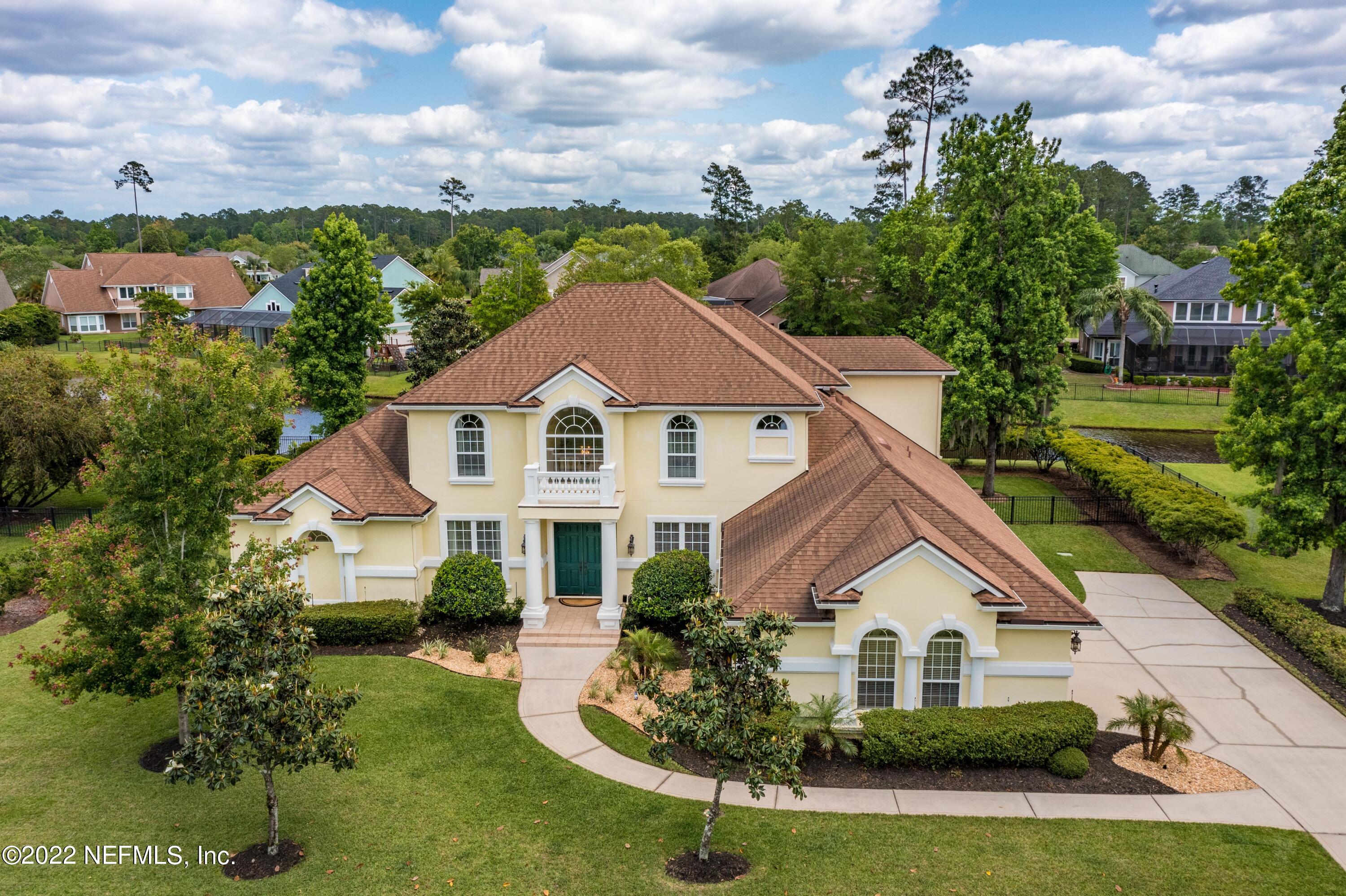 2723 Shade Tree Drive Fleming Island, FL 32003 - Photo 46 of 93 a front view of a house with a yard