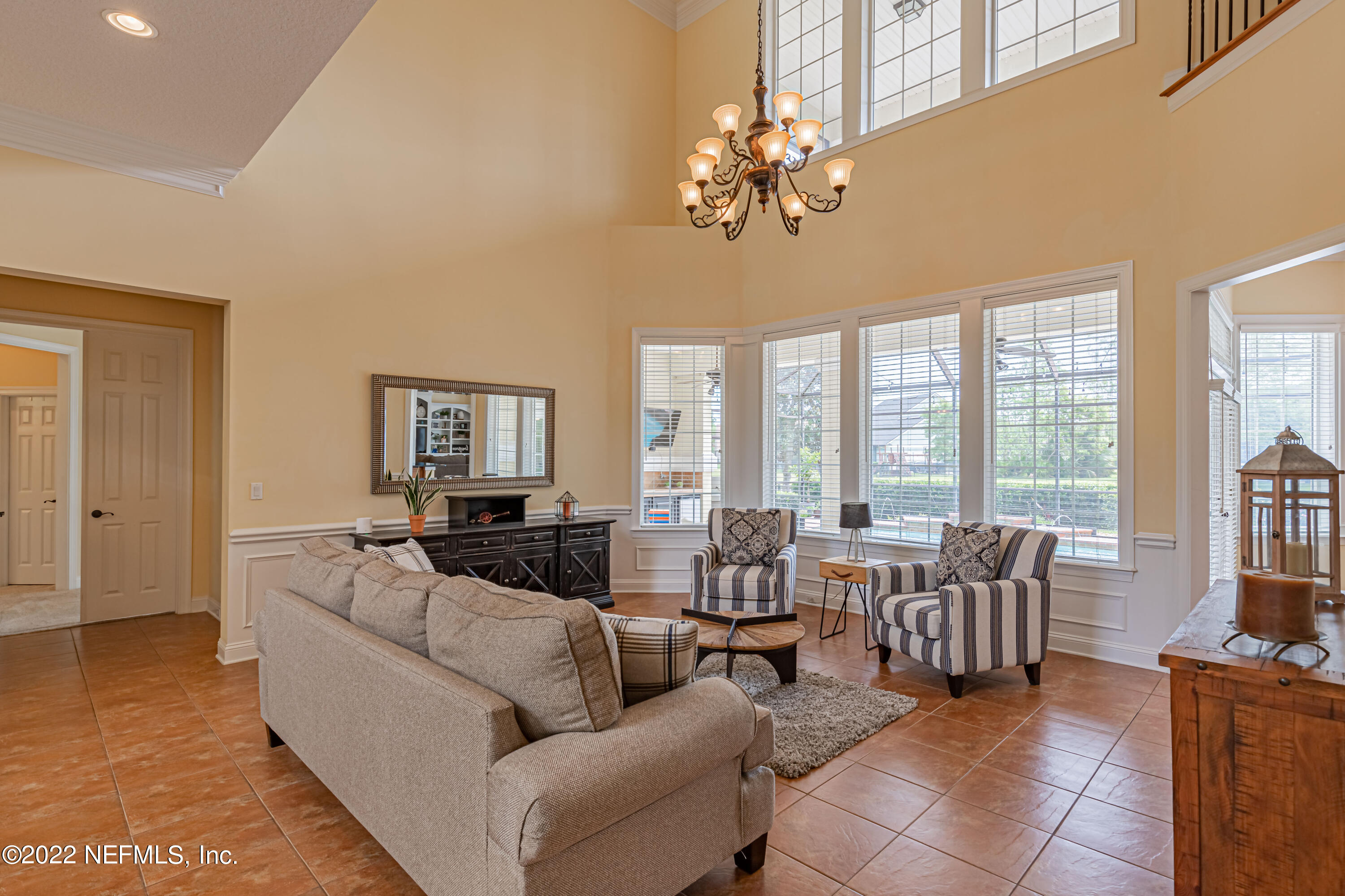 2723 Shade Tree Drive Fleming Island, FL 32003 - Photo 7 of 93 a living room with furniture and large windows