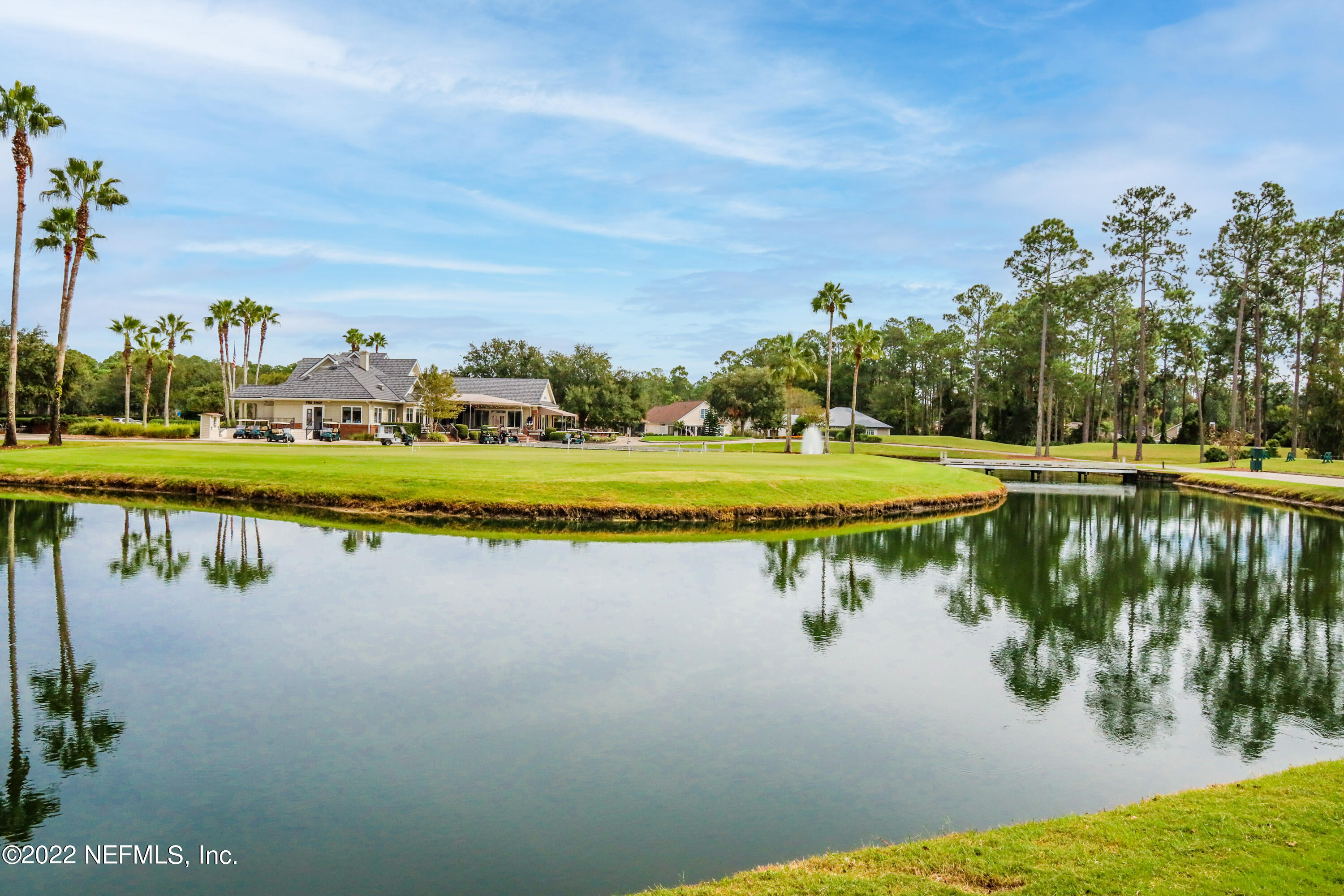 2723 Shade Tree Drive Fleming Island, FL 32003 - Photo 75 of 93 a view of a lake with houses in the back