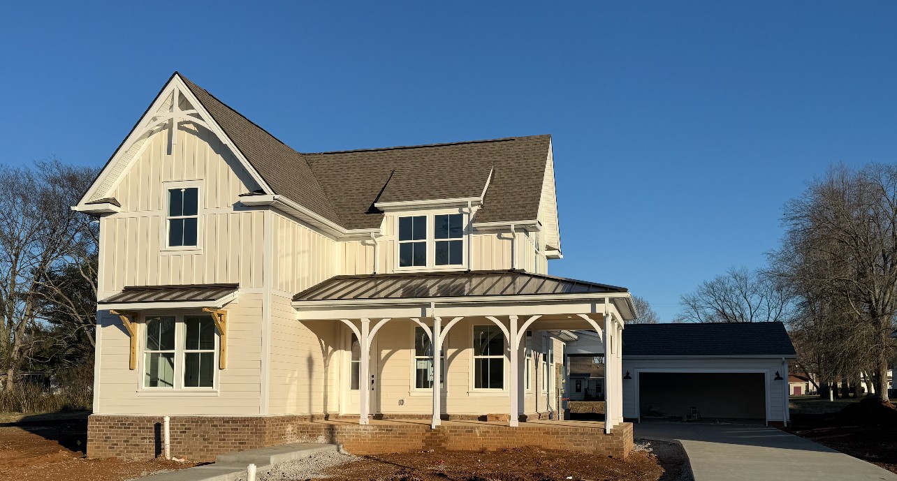 a view of a house with a street