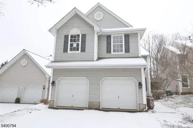 a front view of a house with a garage
