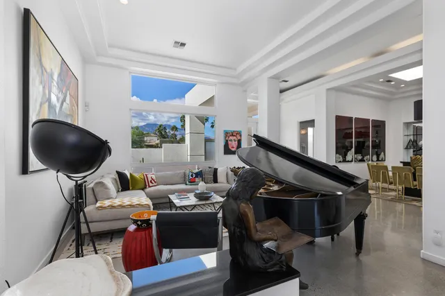 a view of kitchen with sink dining table and chairs