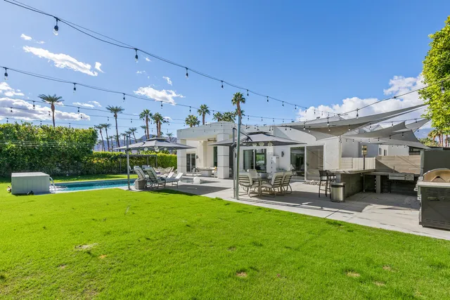 a view of a dinning table and chairs in patio