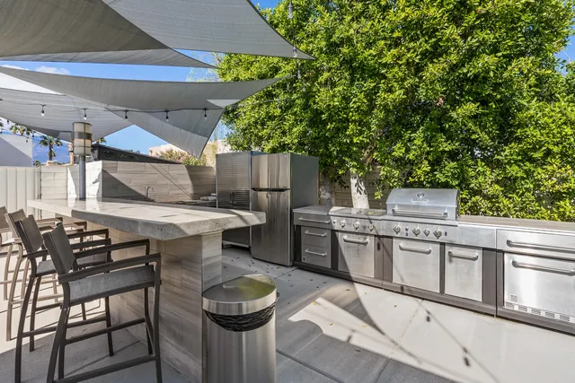 a patio with a patio table and chairs