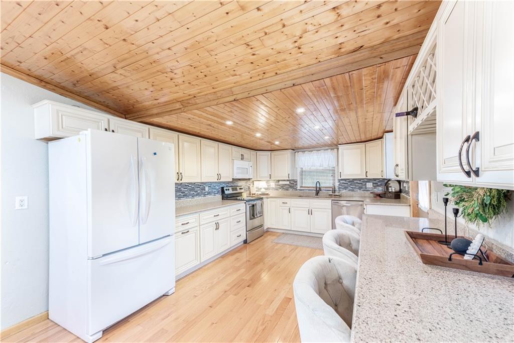 320 Deerfield Road Washington, PA 15301 - Photo 11 of 32 a kitchen with white cabinets and stainless steel appliances