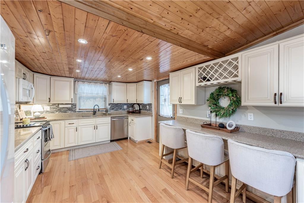 320 Deerfield Road Washington, PA 15301 - Photo 12 of 32 a kitchen with white cabinets and white appliances