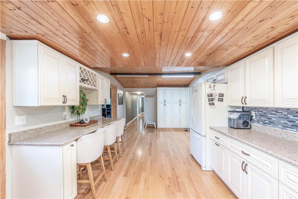 320 Deerfield Road Washington, PA 15301 - Photo 13 of 32 a kitchen with granite countertop lots of counter top space and wooden floor