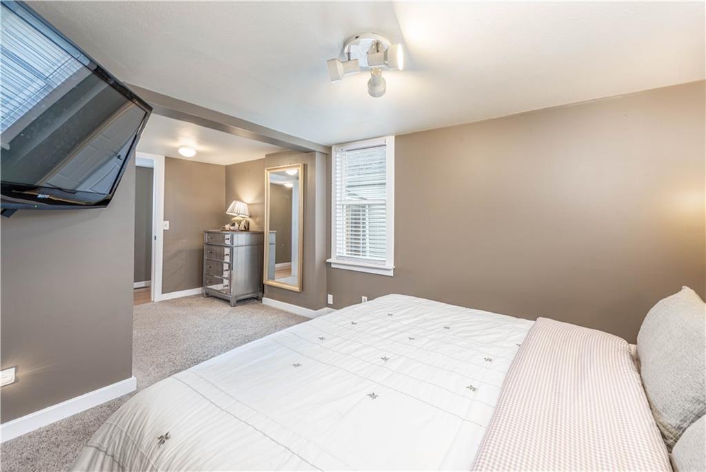 320 Deerfield Road Washington, PA 15301 - Photo 16 of 32 a bedroom with a bed and a chandelier