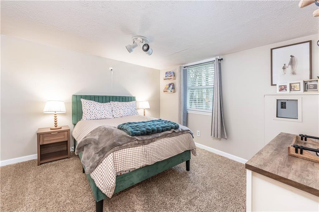 320 Deerfield Road Washington, PA 15301 - Photo 17 of 32 a bedroom with a bed and wooden floor