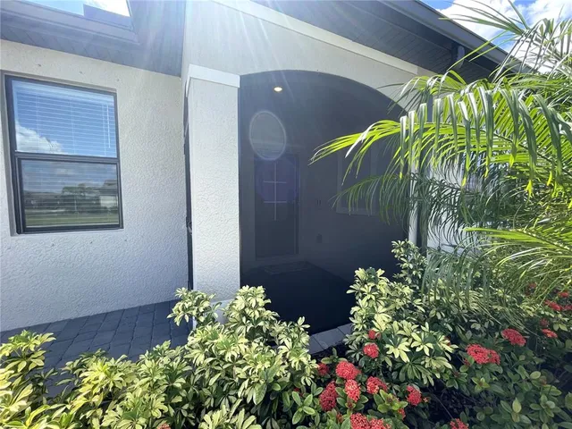 a kitchen with stainless steel appliances granite countertop white cabinets and a stove top oven