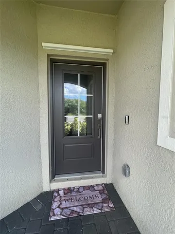 a kitchen with granite countertop white cabinets and stainless steel appliances