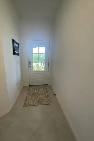 a kitchen with a refrigerator a stove a sink and a granite counter tops